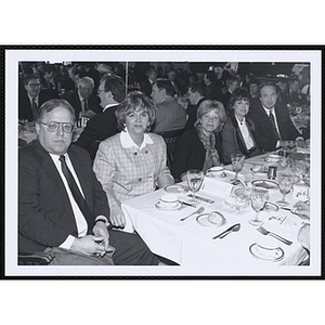 Two men and three women seated around a table at a St. Patrick's Day Luncheon