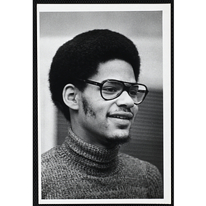 An African American man from the Boys' Clubs of Boston wearing glasses