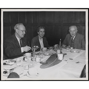 Executive Director of Boys' Club of Boston Arthur T. Burger (left), Barbara Sherman Burger (center), and an unidentified man attend a Tom Pappas Chefs' Club dinner