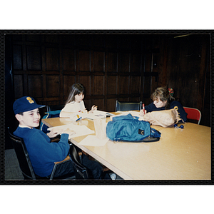 A Group of children working on their homework at a table