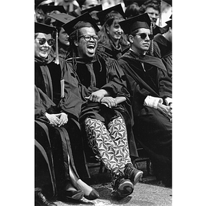 A Law School graduate laughs during commencement