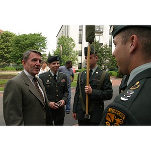 General Richard Neal stands with three men in military dress at the Veterans Memorial groundbreaking ceremony