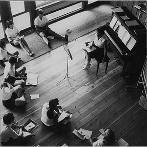 Boston-Bouvé students seated in a semi-circle around a music professor