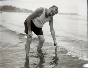 Carl Krippendorf, taking the temperature of the water on the beach