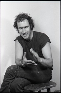 Studio portrait of Richard Safft, seated on a stool