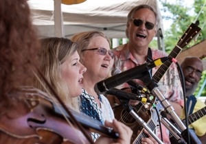 Lisa Gutkin (obscured), Dar Williams, Holly Near, David Amram, Tom Chapin, and Josh White, Jr.(from left) performing on the Rainbow stage at the Clearwater Festival