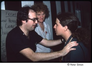 MUSE concert and rally: John Landau (left) talking to MUSE staff member with Tom Campbell in the background, backstage at the MUSE concert