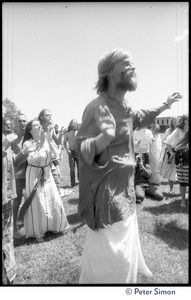 Bhagavan Das, arms raised, dancing at Sonoma State University