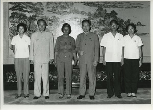 Shirley Graham Du Bois standing with Zhou Enlai and other unidentified Chinese officials