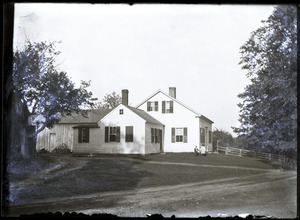 Young boy and girl holding hands in front of house last owned by George Smith (Greenwich, Mass.)