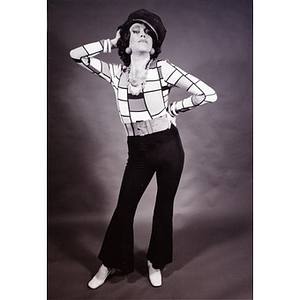 Press photo of Abe Rybeck posing with a hat and 70s attire