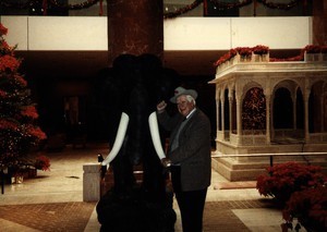Thomas P. O'Neill posing with a statue of an elephant