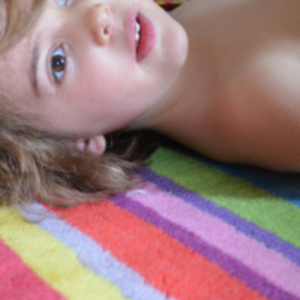 Child lying on rug