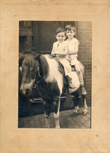 Brothers on pony outside of Fox's drug store