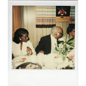 Laymon and Inez Irving Hunter eat a meal with friends