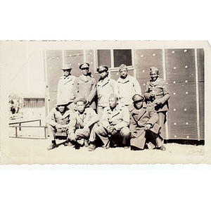 A group of soldiers pose on an unknown army base