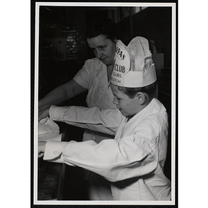 A member of the Tom Pappas Chefs' Club visits the Hanscom Field Air Force Base restaurant kitchen