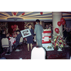 Photograph presentation at the Chinese Progressive Association's 20th Anniversary and the Workers' Center's 10th Anniversary celebration