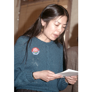 Woman reads a script during a Chinese Progressive Association gathering