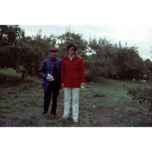 People in an orchard on a Chinese Progressive Association trip