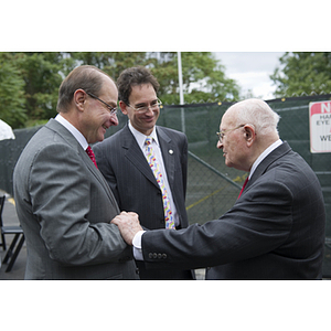 Dr. George J. Kostas stands with President Joseph E. Aoun and David E. Luzzi, dean of the College of Engineering