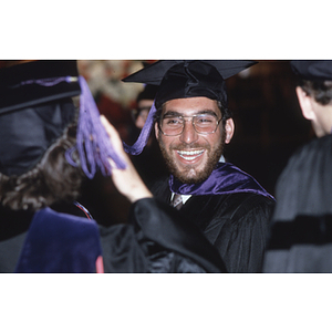 School of Law graduate smiling at the commencement ceremony for the Class of 1982