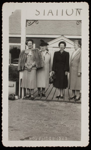 Women standing at the entrance of the Edaville Station (2 of 2)