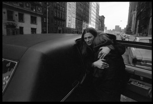 Judy Collins hugging a child by a limousine