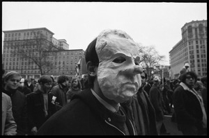 Anti-Vietnam War protester in a paper mache Nixon mask during the Counter-inaugural demonstrations, 1969