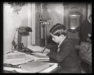 Francis X. Curley (son of James Michael Curley) writing at a desk