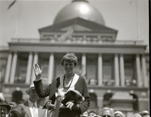 Amelia Earhart reception: Earhart waving to the crowd in front of the Massachusetts state capitol