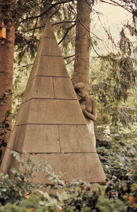 Statue of a woman and a pyramid