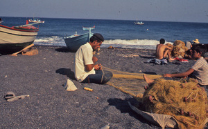 Fishermen mending their nets