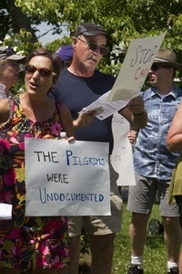 Pro-immigration protesters and signs outside the Chatham town offices building, one with sign reading 'The Pilgrims were undocumented' : taken at the 'Families Belong Together' protest against the Trump administration's immigration policies