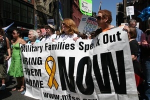 Marchers behind the banner for 'Military Families Speak Out' during protest against the war in Iraq