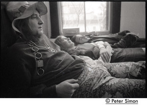 Peter Bellamy, Heather Wood, Royston Wood (l. to r.) of Young Tradition, lying on a bed