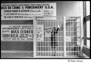 Woman posing in cell, waving a handkerchief