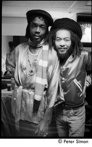 Peter Tosh (left) with unidentified man backstage on Saturday Night Live: three-quarter length portrait