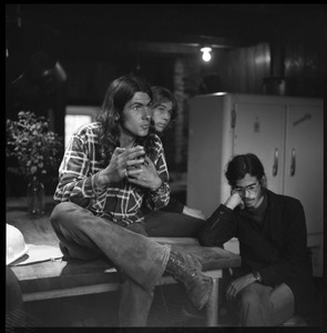 Members of the Brotherhood of the Spirit commune, seated in the commune kitchen