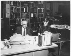 Martin Hubbard and Joyce Merriam at reference desk in Goodell addition