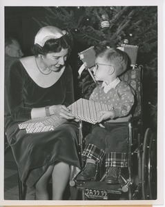 Rose Bampton with young boy in wheelchair at Christmas