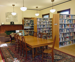 Buckland Public Library: interior seating area, tables, and bookcases