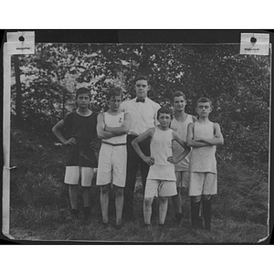 Group of youth pose for photo outdoors at Camp School, Allston