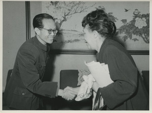 Shirley Graham Du Bois shaking hands with unidentified Chinese official