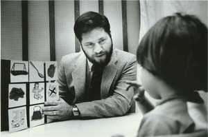 Nelson Cowan, sitting indoors with child