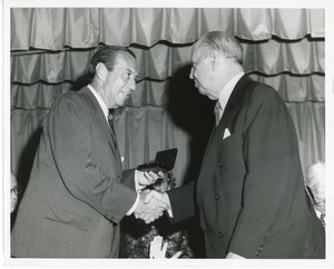 Jeremiah Milbank, Sr. handing a medal to Robert F. Wagner