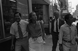 Davis Woo, Kathryn White, Mayor Kevin White, and Billy Chin walk in Chinatown during the 1979 August Moon Festival