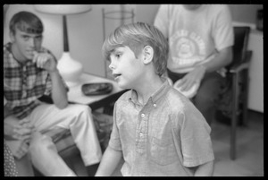 Teenage long hair: young boy among the teenagers