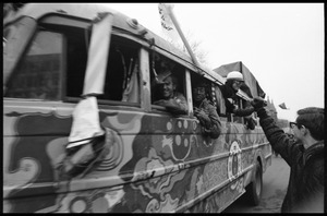 Protesters greeting people riding the psychedlic bus 'The Road Trip' during the Counter-inaugural demonstrations, 1969