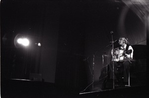 Unidentified female twelve-string guitar player in concert